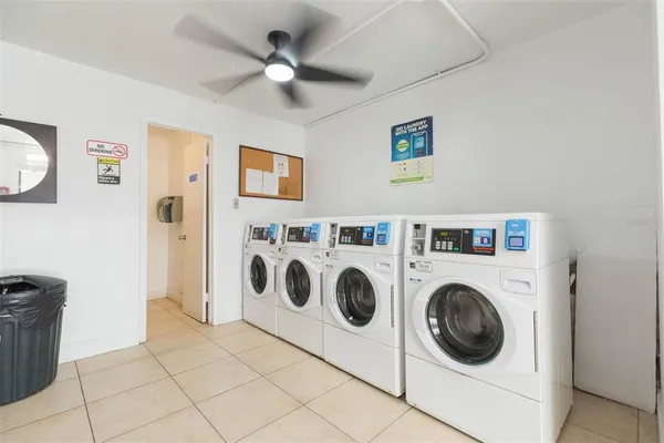 a view of a patio with swimming pool table and chairs