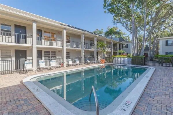 a view of a swimming pool with a lounge chair