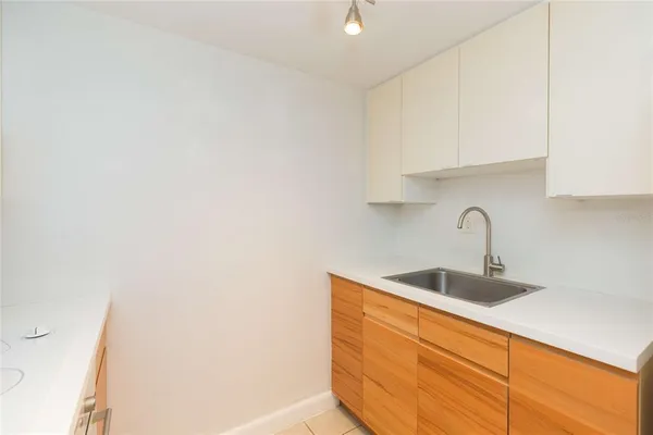 a kitchen with a sink and cabinets