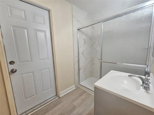 a bathroom with a sink and shower