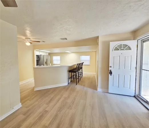 a view of a livingroom with furniture and wooden floor