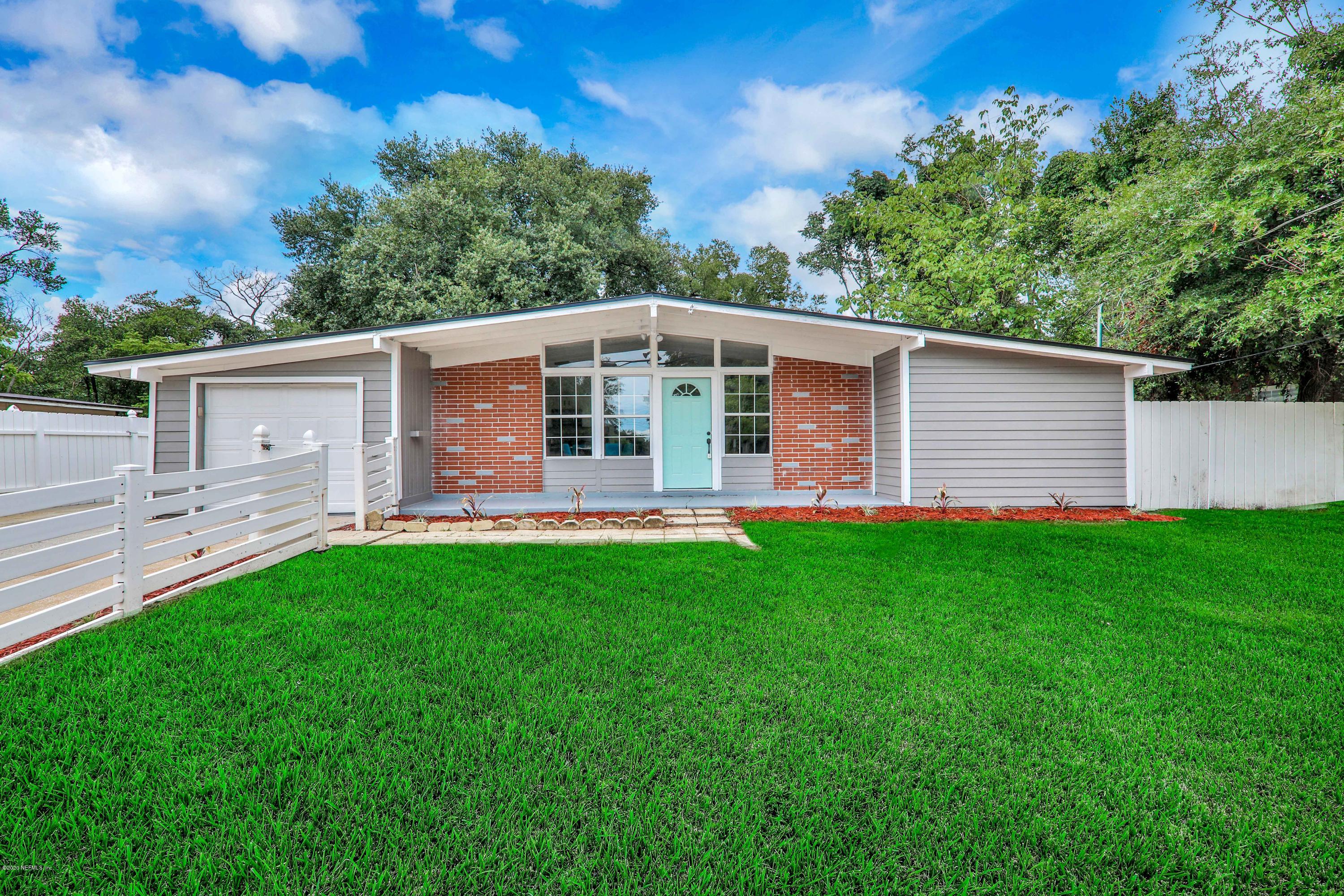 7359 Sandhurst Road South Jacksonville, FL 32277 - Photo 1 of 34 a front view of house with yard and green space