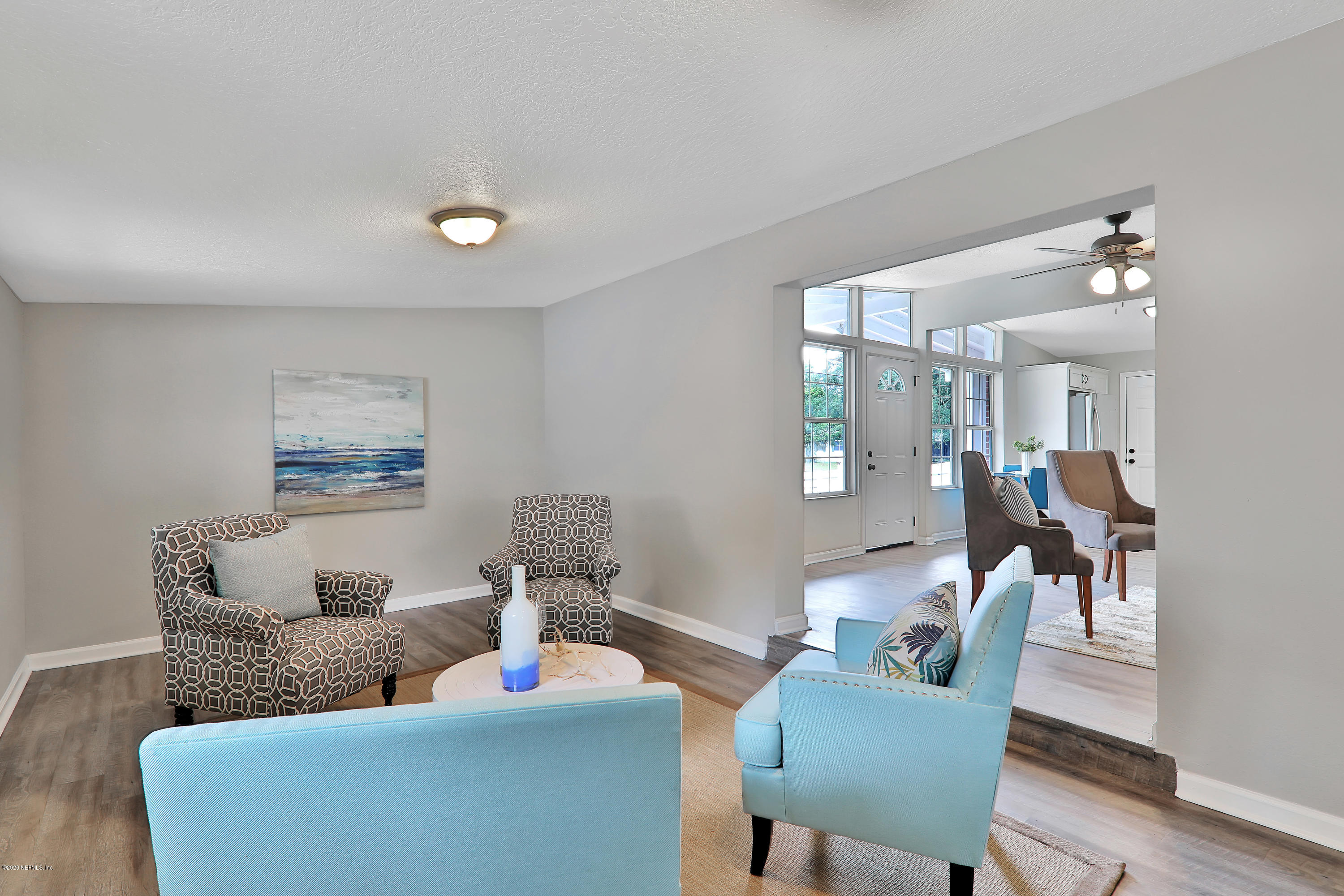 7359 Sandhurst Road South Jacksonville, FL 32277 - Photo 14 of 34 a living room with furniture and a table