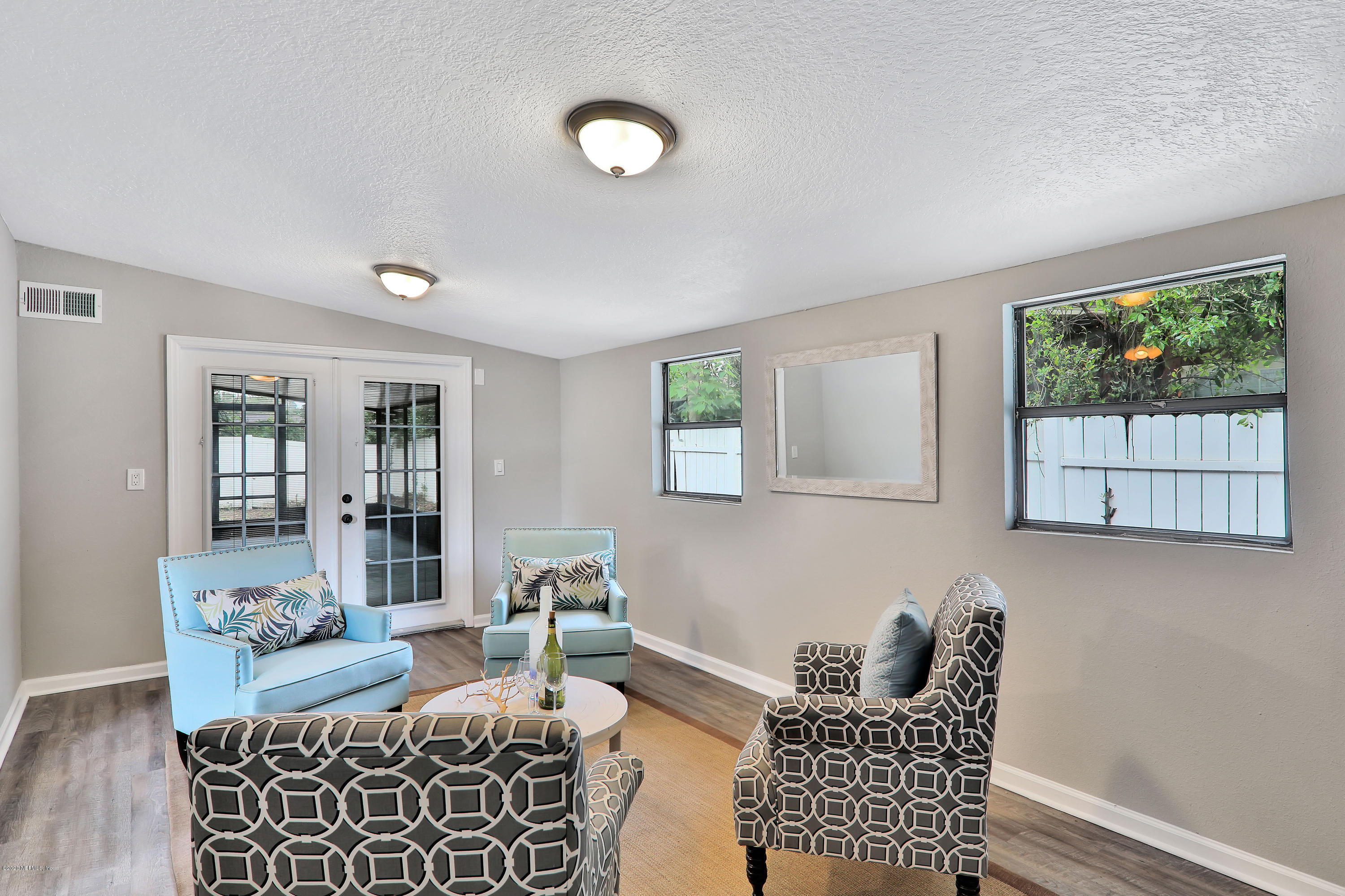 7359 Sandhurst Road South Jacksonville, FL 32277 - Photo 15 of 34 a living room with furniture and a window