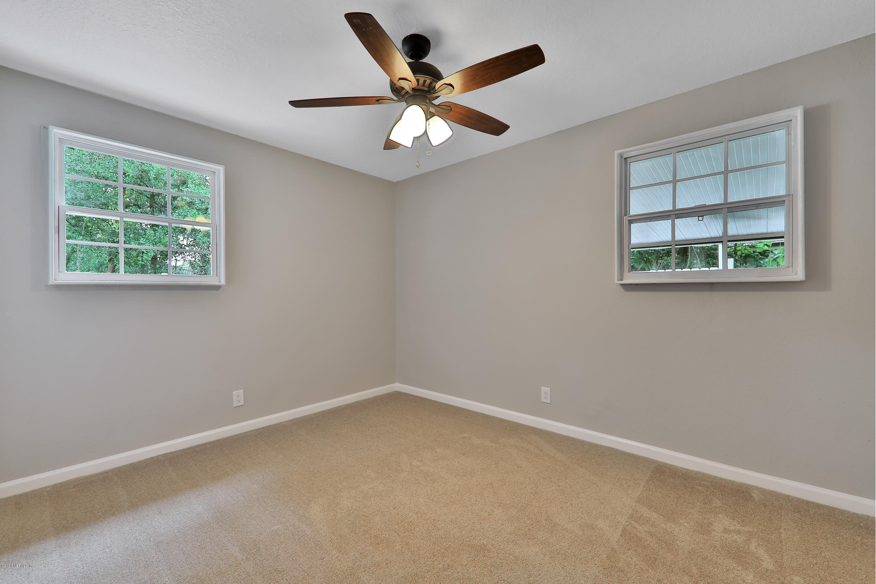 7359 Sandhurst Road South Jacksonville, FL 32277 - Photo 21 of 34 an empty room with a window