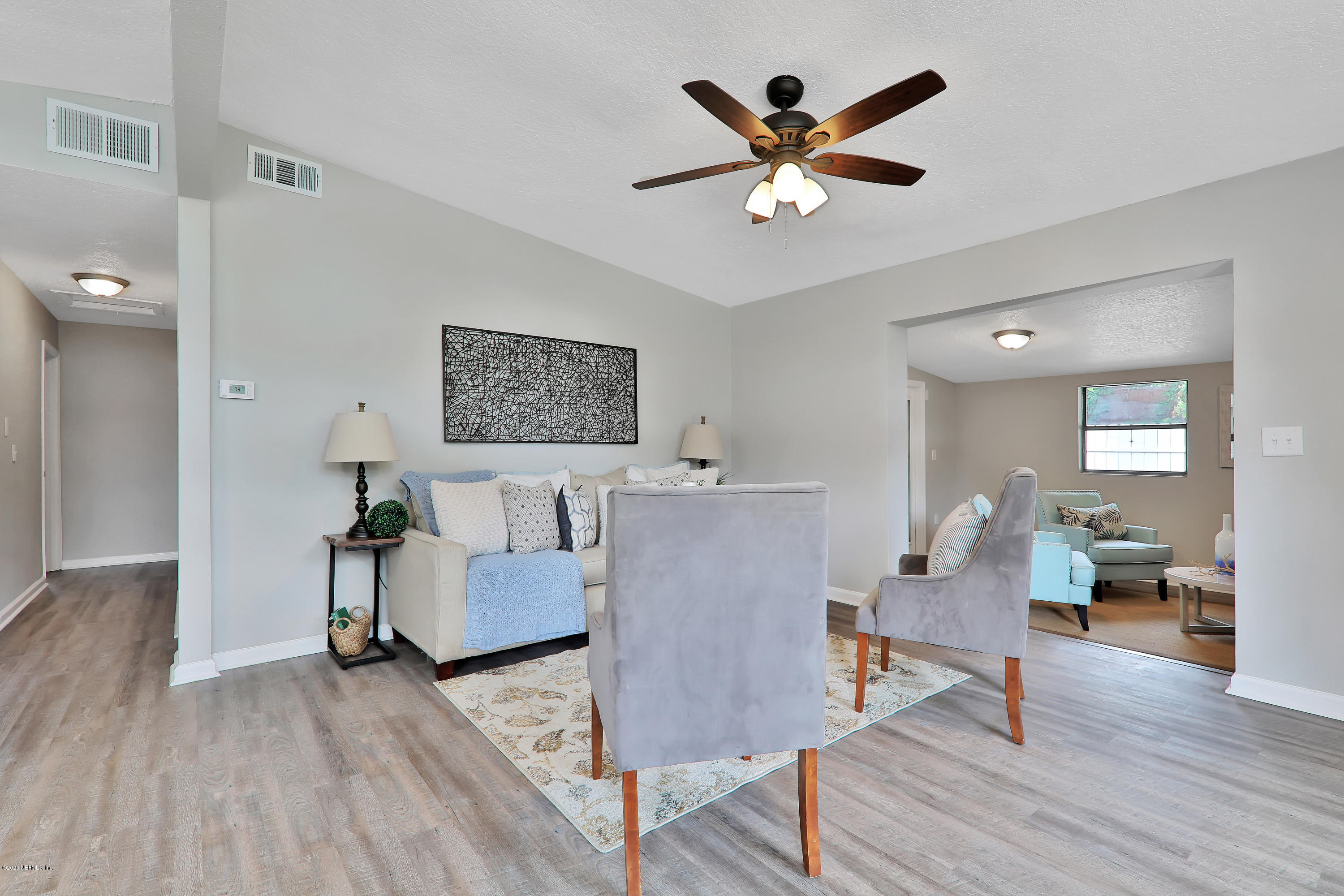 7359 Sandhurst Road South Jacksonville, FL 32277 - Photo 3 of 34 a living room with furniture and wooden floor