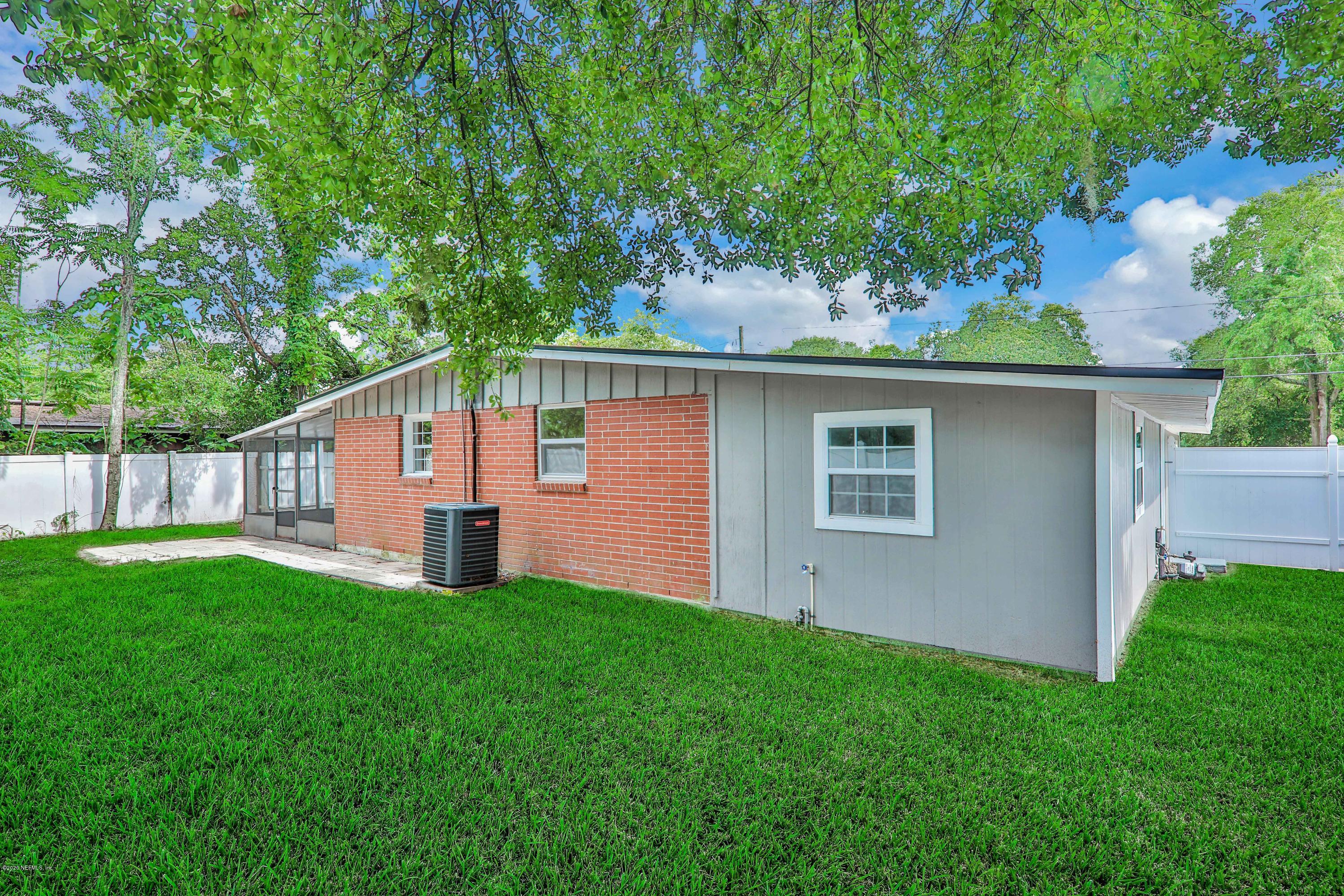 7359 Sandhurst Road South Jacksonville, FL 32277 - Photo 32 of 34 a front view of house with yard and green space