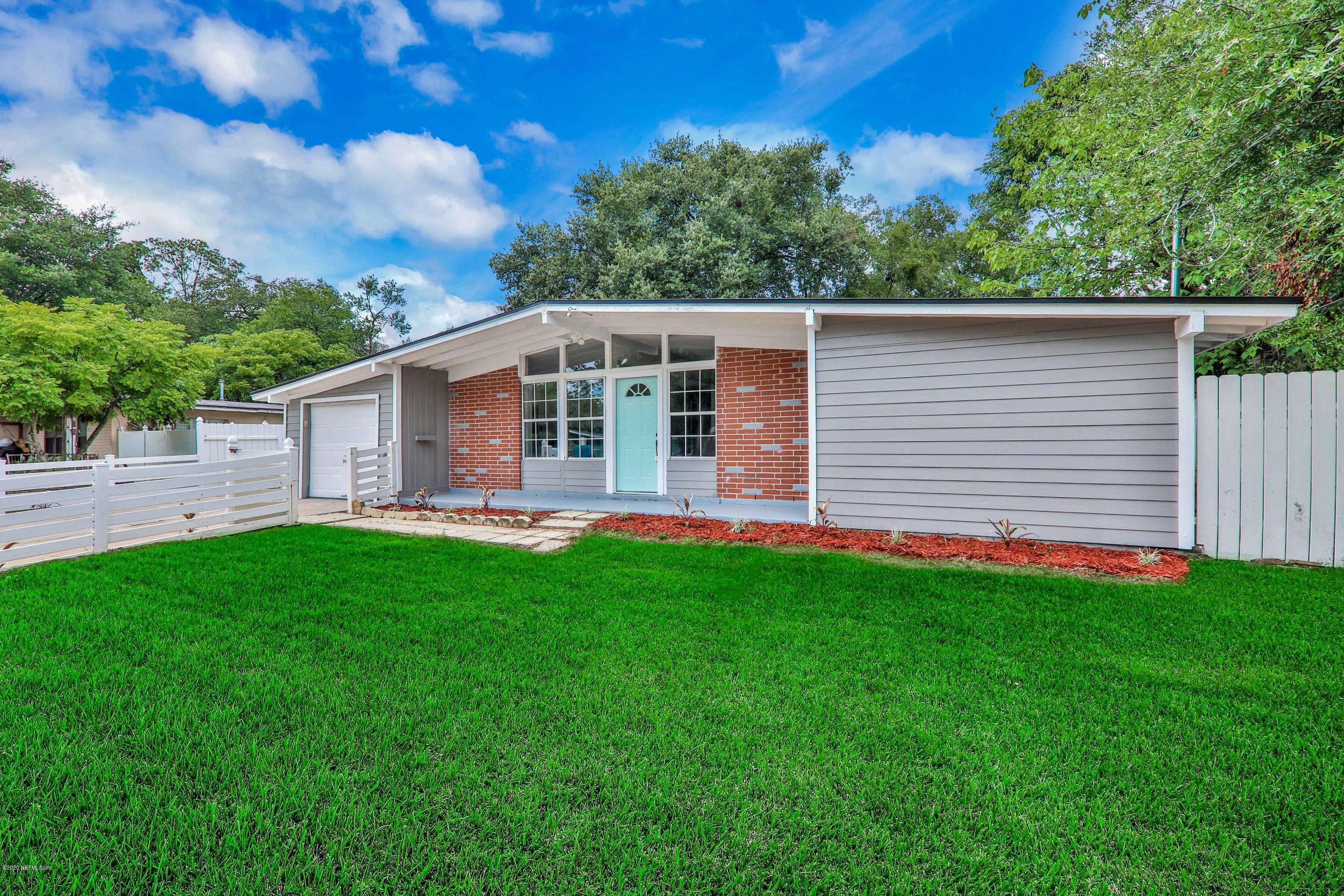 7359 Sandhurst Road South Jacksonville, FL 32277 - Photo 33 of 34 a front view of house with yard and green space