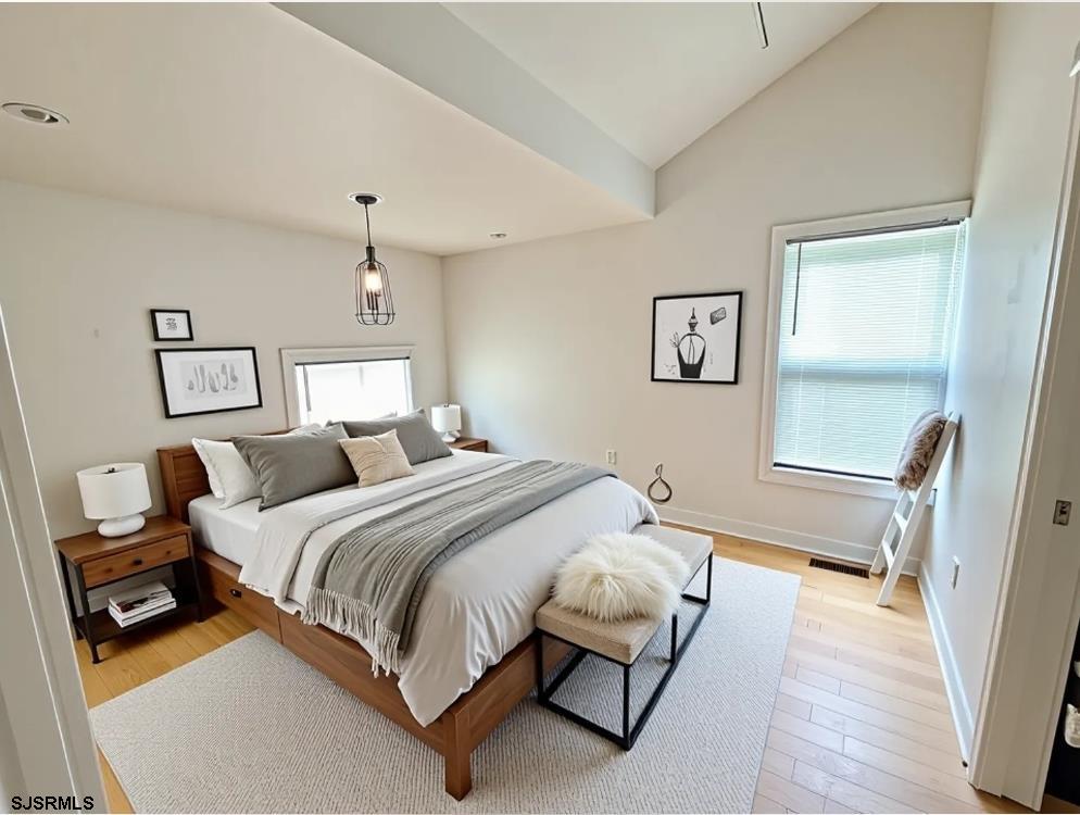 711 Wisteria Road Chelsea Heights, NJ 08401 - Photo 12 of 26 a bedroom with a bed and a window