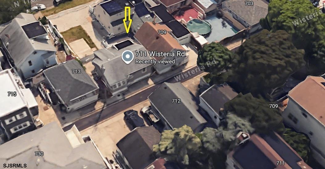 711 Wisteria Road Chelsea Heights, NJ 08401 - Photo 22 of 26 an aerial view of a house with a yard