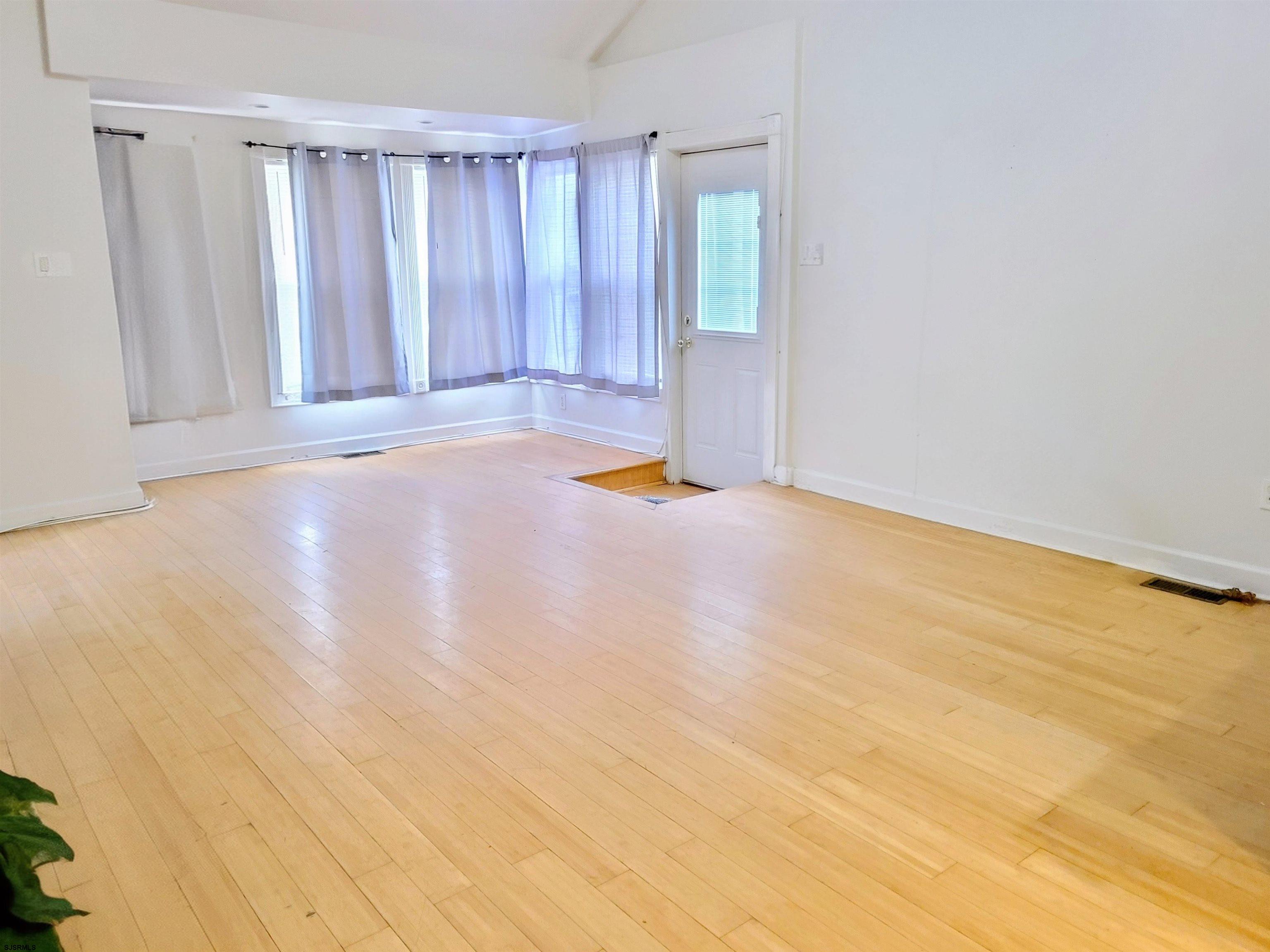 711 Wisteria Road Chelsea Heights, NJ 08401 - Photo 4 of 26 a view of an empty room with a window