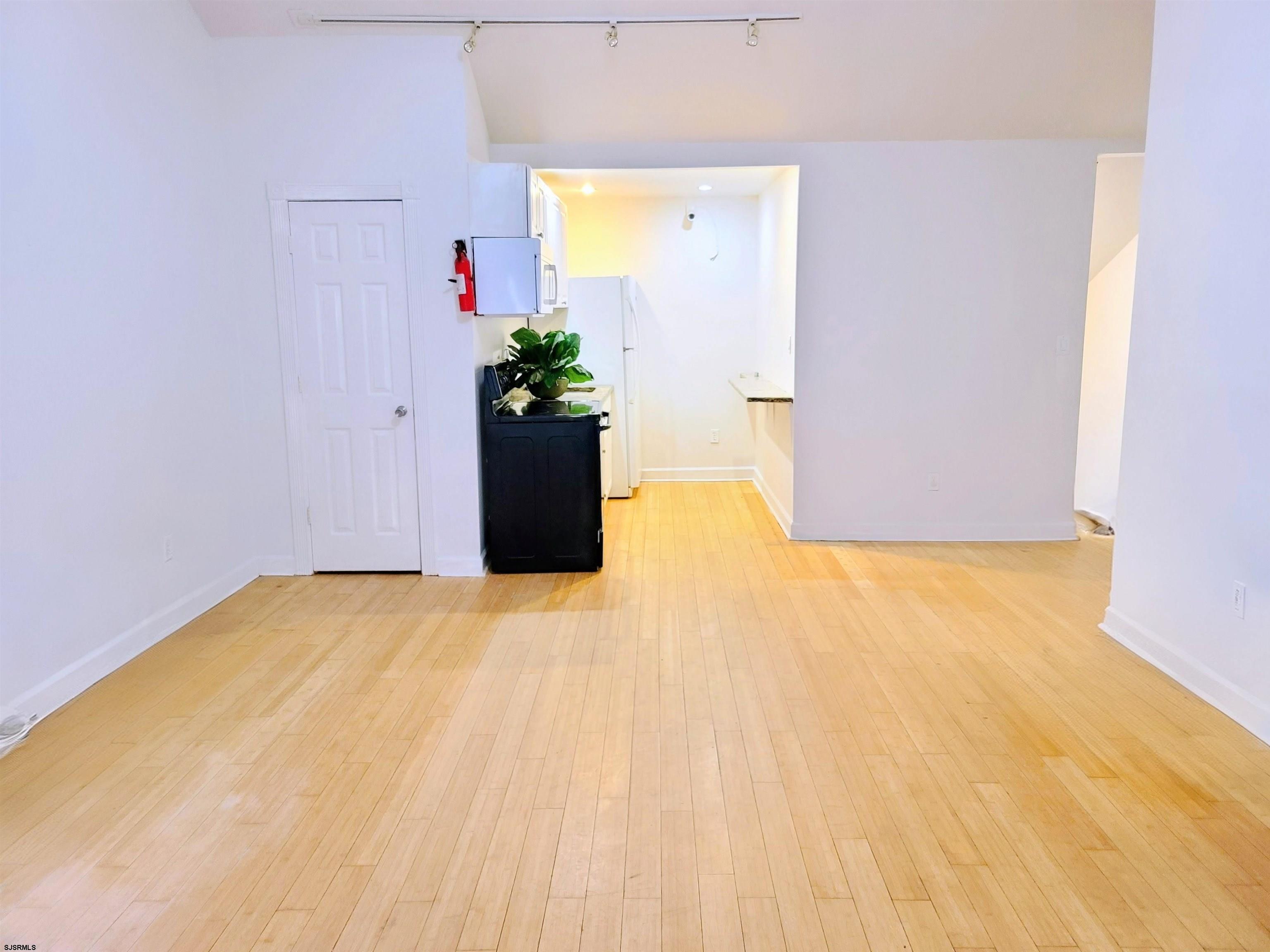 711 Wisteria Road Chelsea Heights, NJ 08401 - Photo 6 of 26 a view of a room with wooden floor