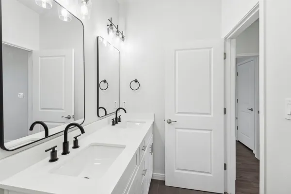 a bathroom with a double vanity sink