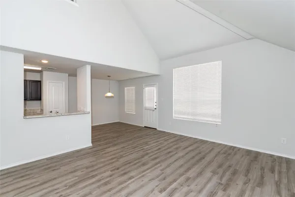 a view of a livingroom with wooden floor