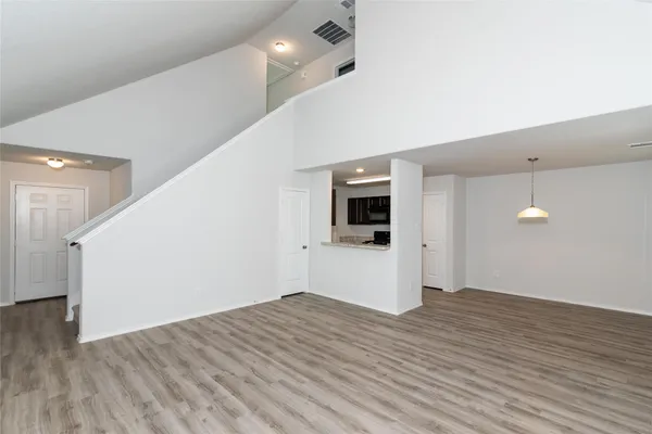 a view of a kitchen with a sink and a microwave