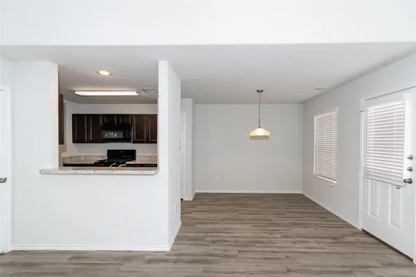 a open kitchen with a sink and a stove top oven