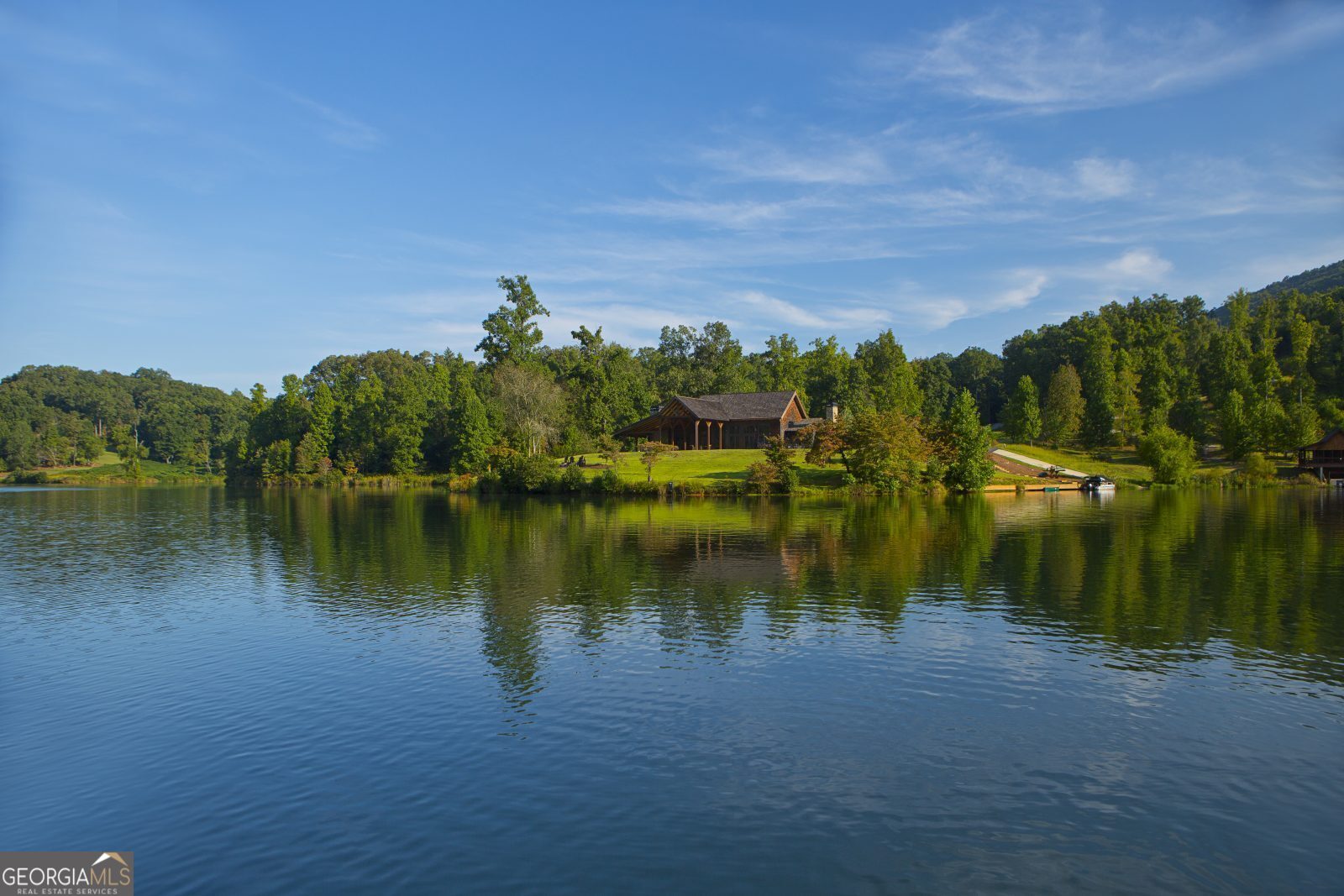 Lot 239 Shore Drive Cleveland, GA 30528 - Photo 7 of 13 a view of a lake in middle of forest
