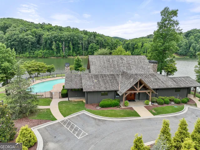 swimming pool with an outdoor seating and yard