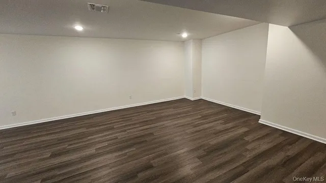 a view of room with wooden floor