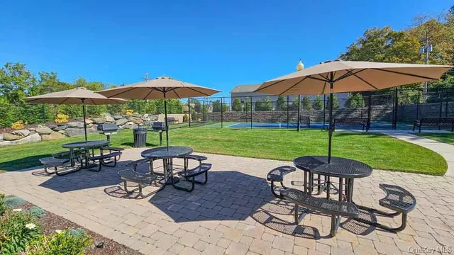 a view of a house with garden and a patio