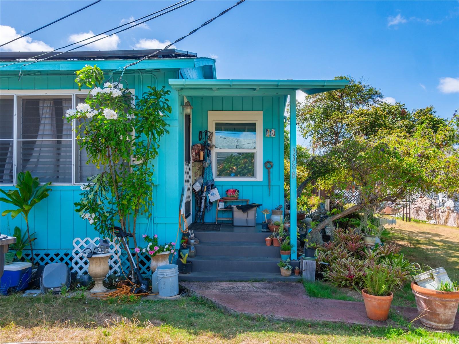 338 Manono Street, Unit B Kailua, HI 96734 - Photo 2 of 25 a view of house with outdoor space and sitting area