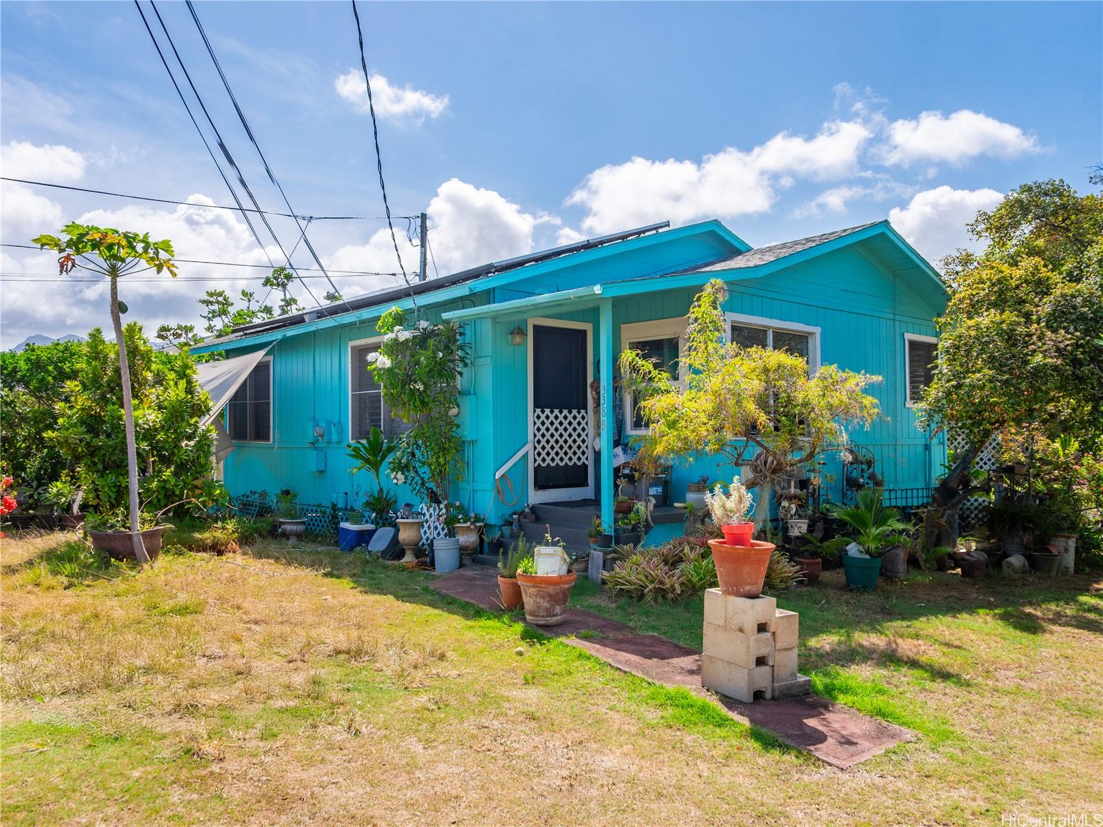 338 Manono Street, Unit B Kailua, HI 96734 - Photo 3 of 25 a front view of a house with garden