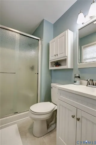 a bathroom with a sink a mirror and a toilet