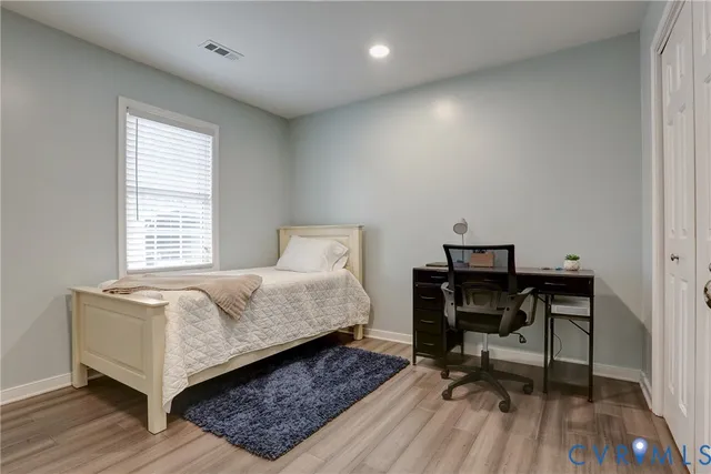 a bedroom with a bed and a table