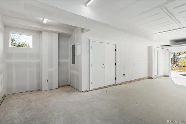 a view of an empty room and a window