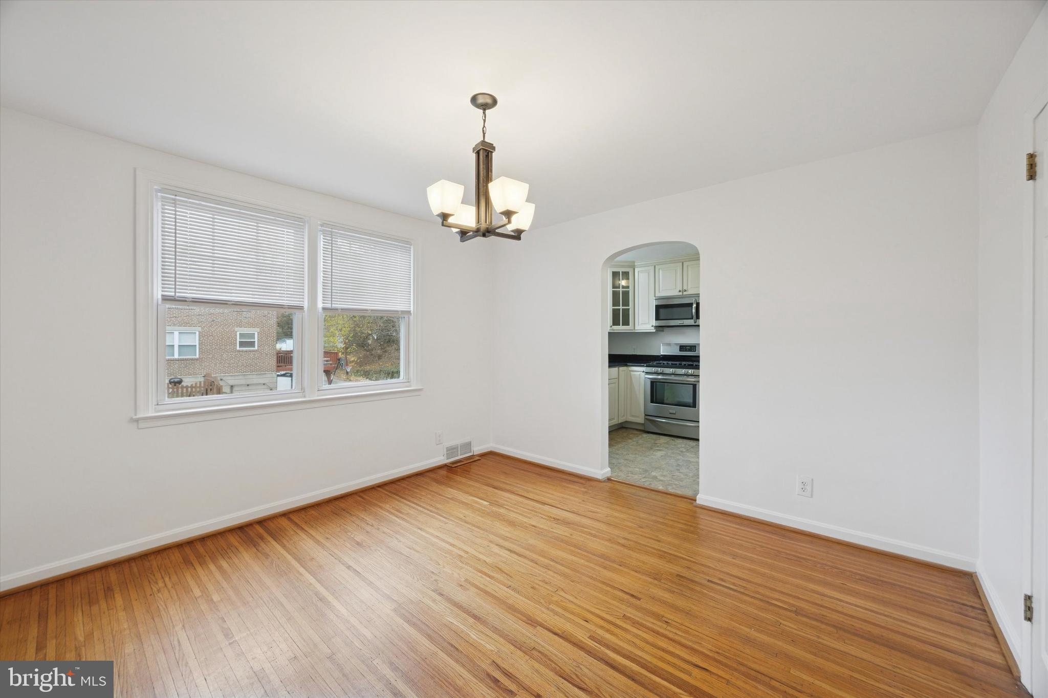 519 Acorn Street Philadelphia, PA 19128 - Photo 12 of 29 wooden floor in an empty room with a window