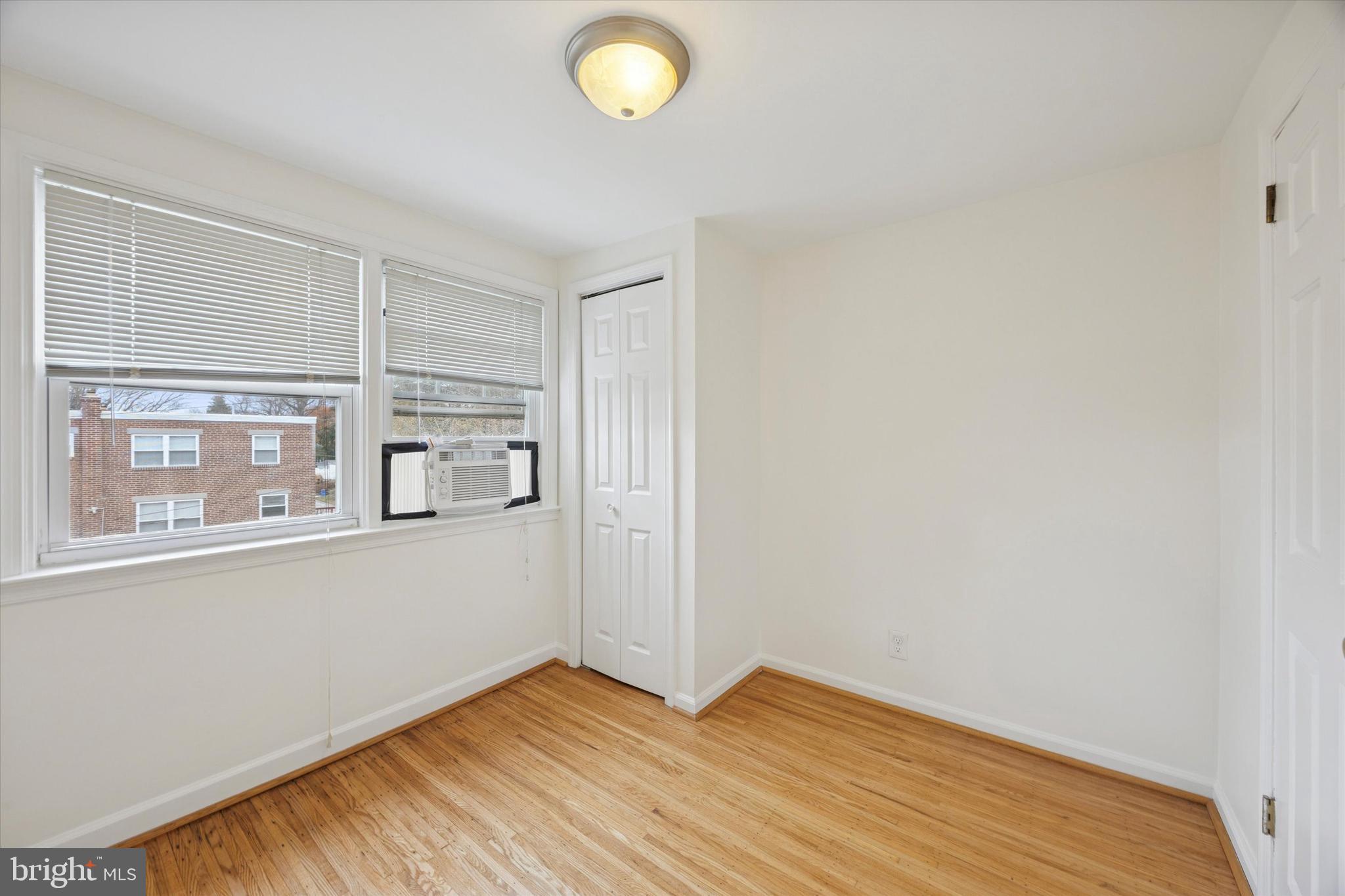 519 Acorn Street Philadelphia, PA 19128 - Photo 19 of 29 a view of empty room with wooden floor and fan