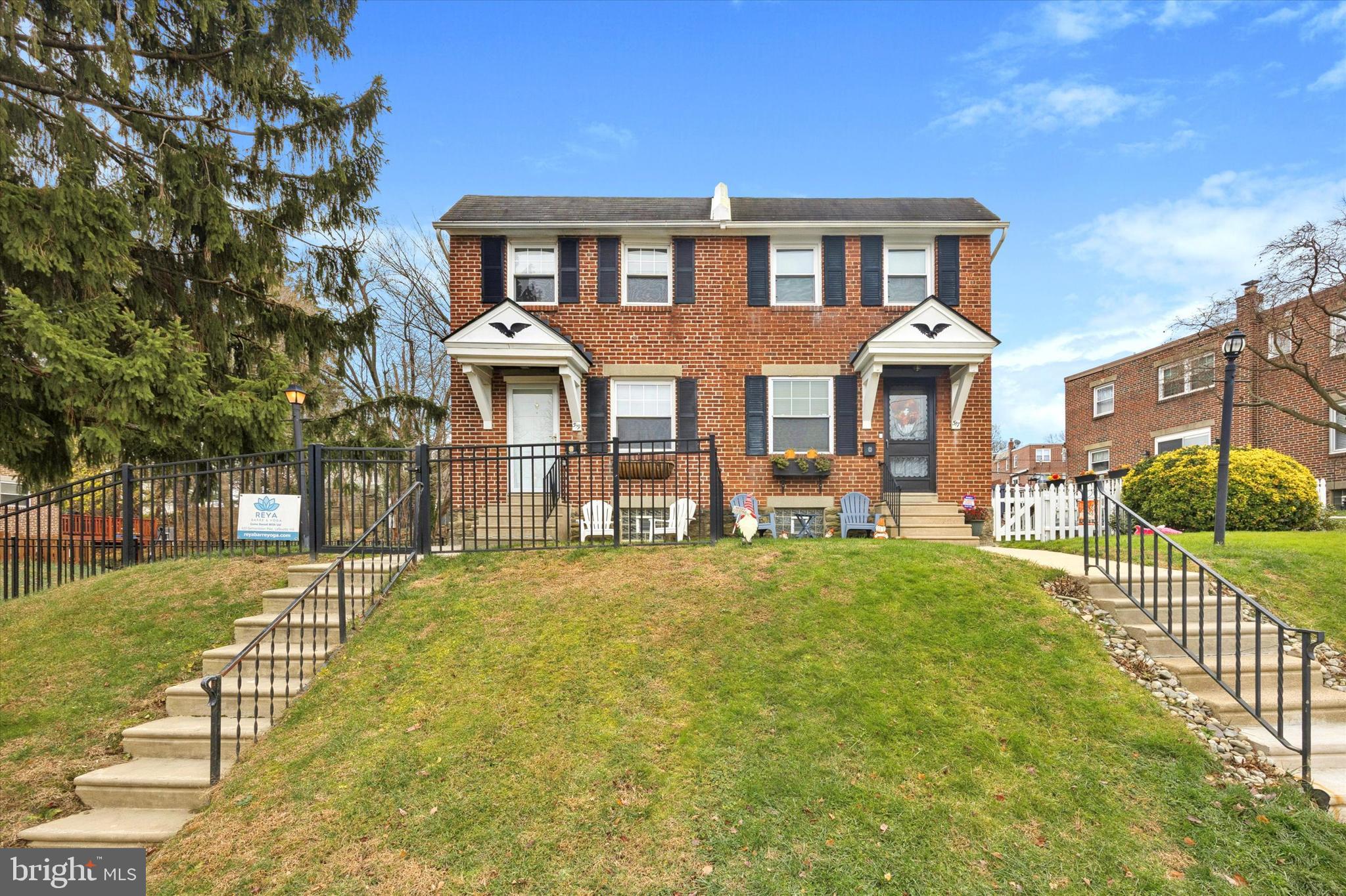 519 Acorn Street Philadelphia, PA 19128 - Photo 2 of 29 a front view of a house with a yard