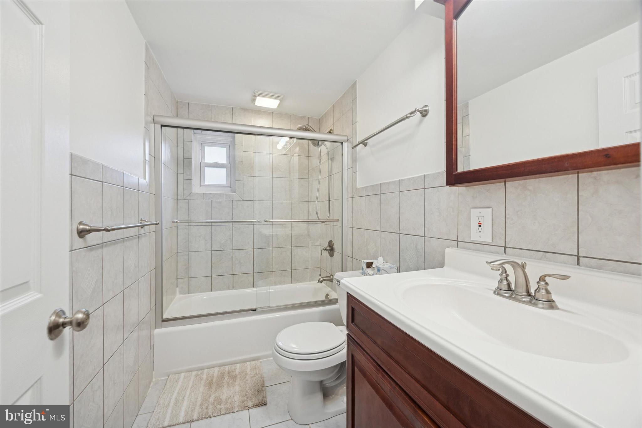 519 Acorn Street Philadelphia, PA 19128 - Photo 21 of 29 a bathroom with a sink a toilet and shower