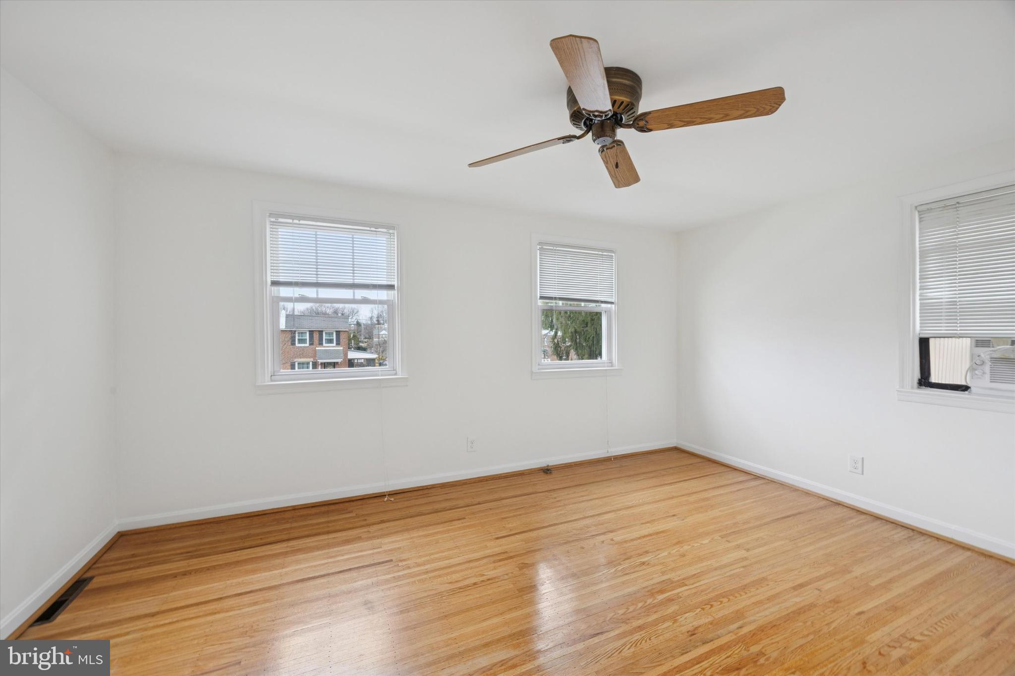 519 Acorn Street Philadelphia, PA 19128 - Photo 22 of 29 a view of a room with wooden floor and a ceiling fan