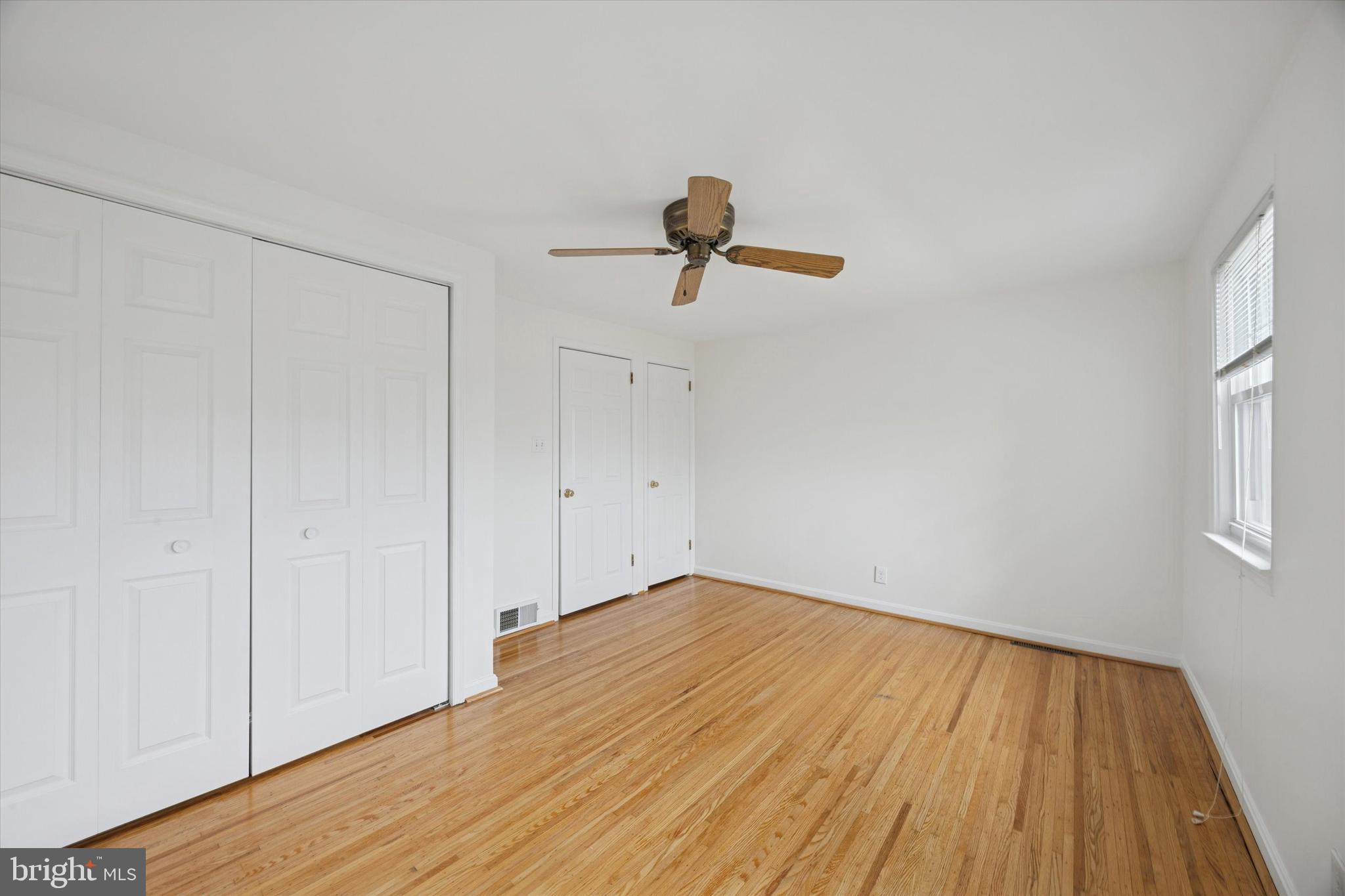 519 Acorn Street Philadelphia, PA 19128 - Photo 24 of 29 a view of empty room with wooden floor and fan