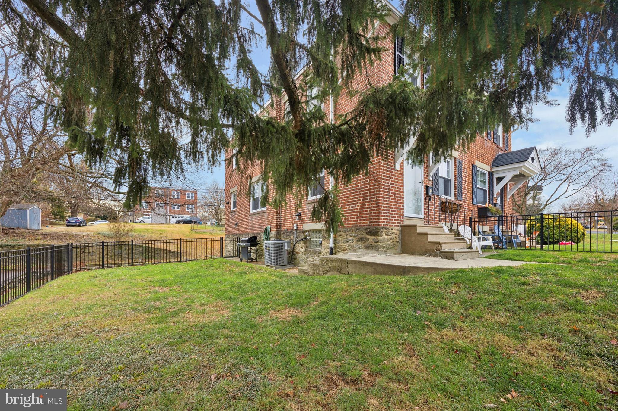 519 Acorn Street Philadelphia, PA 19128 - Photo 4 of 29 a view of yard with swimming pool and green space