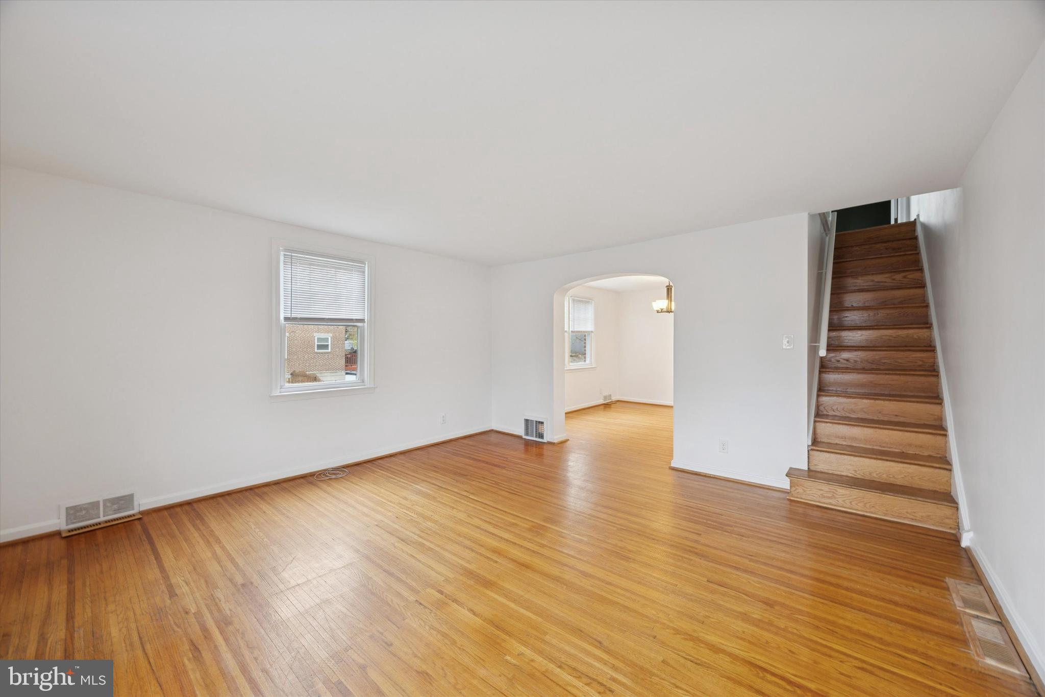 519 Acorn Street Philadelphia, PA 19128 - Photo 8 of 29 a view of an empty room with wooden floor and a window