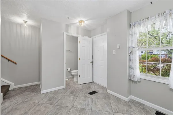 a view of a bathroom with a shower and a sink