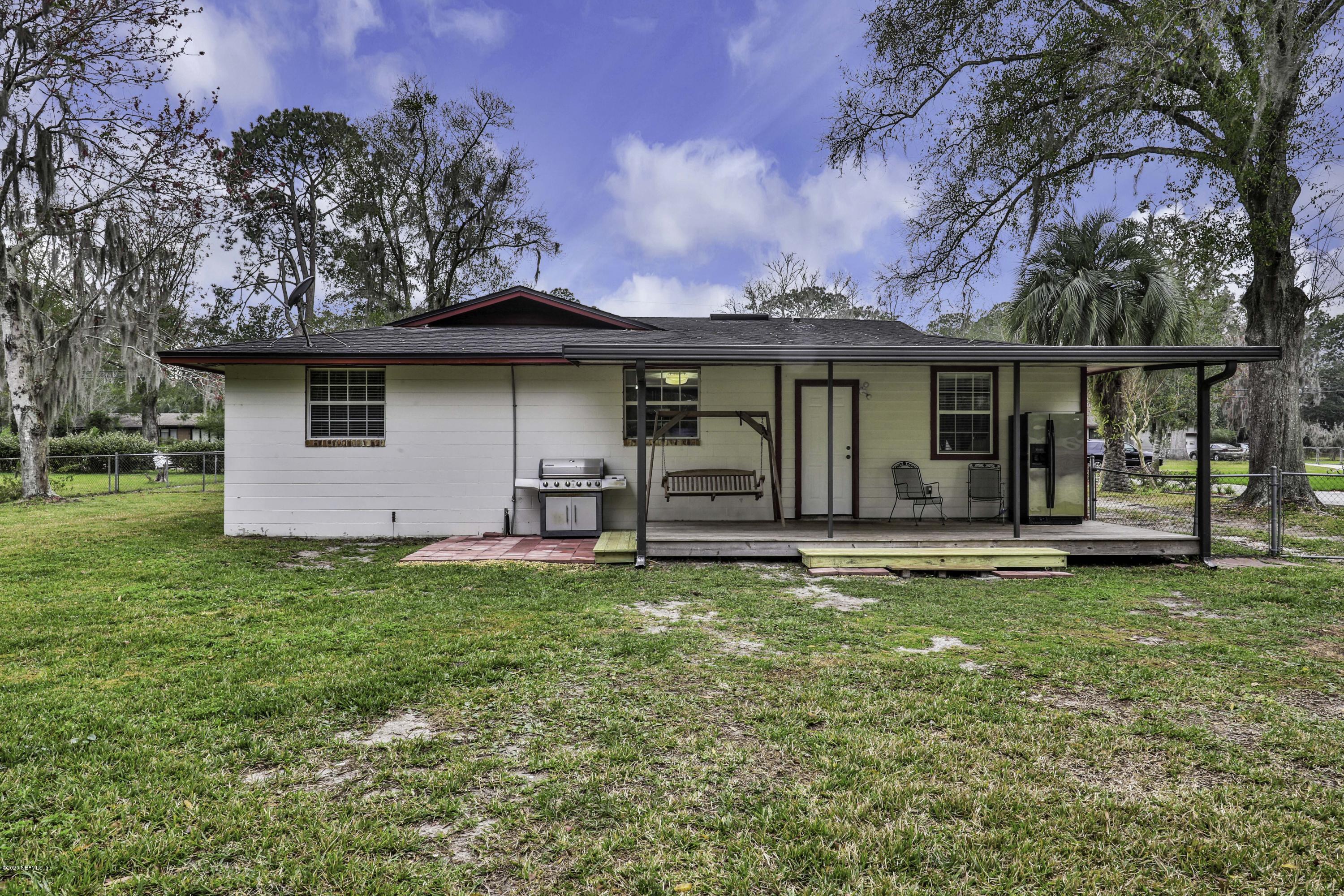 6161 Carlton Road Jacksonville, FL 32244 - Photo 18 of 26 a view of a house with backyard porch and furniture