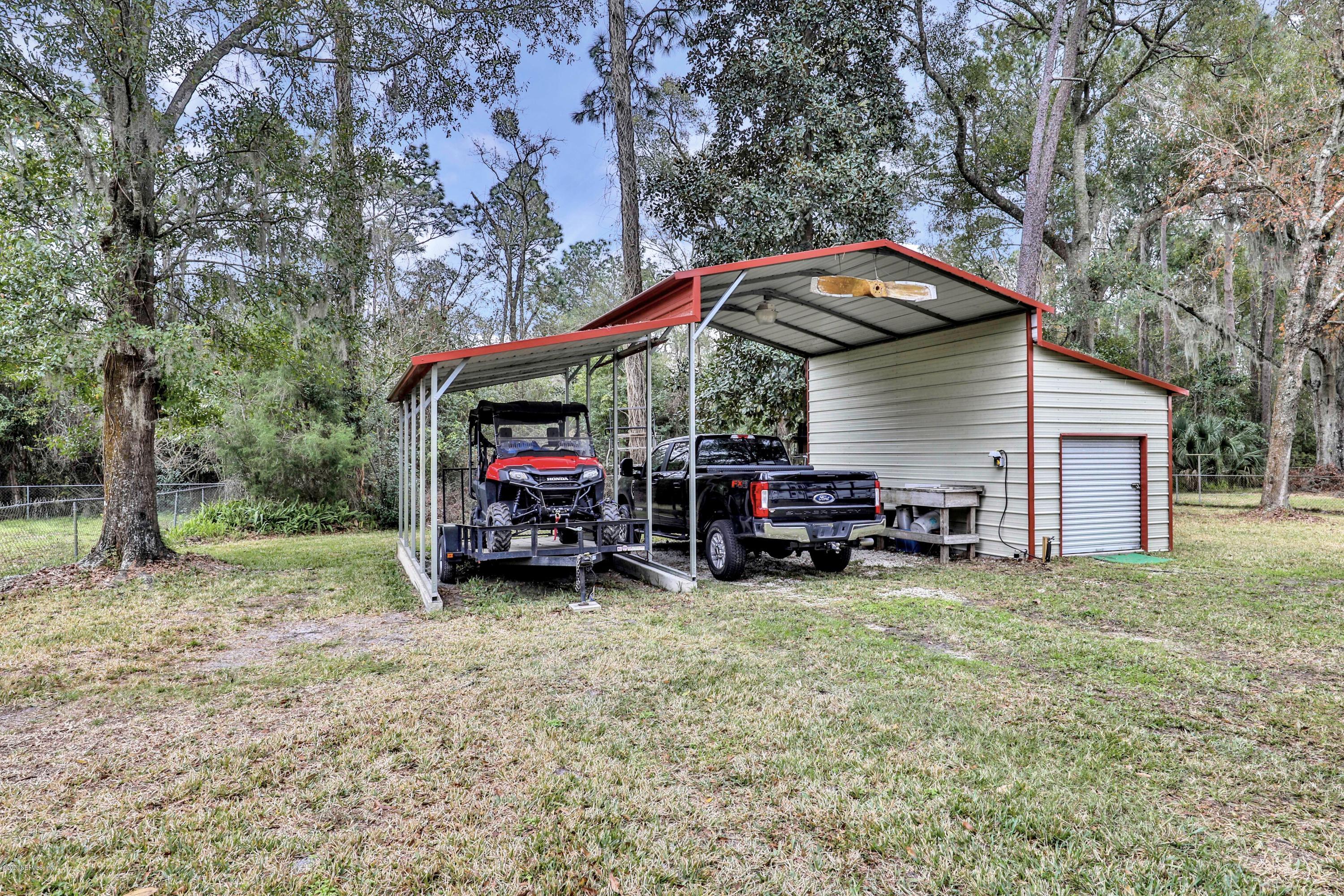 6161 Carlton Road Jacksonville, FL 32244 - Photo 2 of 26 a view of a house with a small yard and sitting area