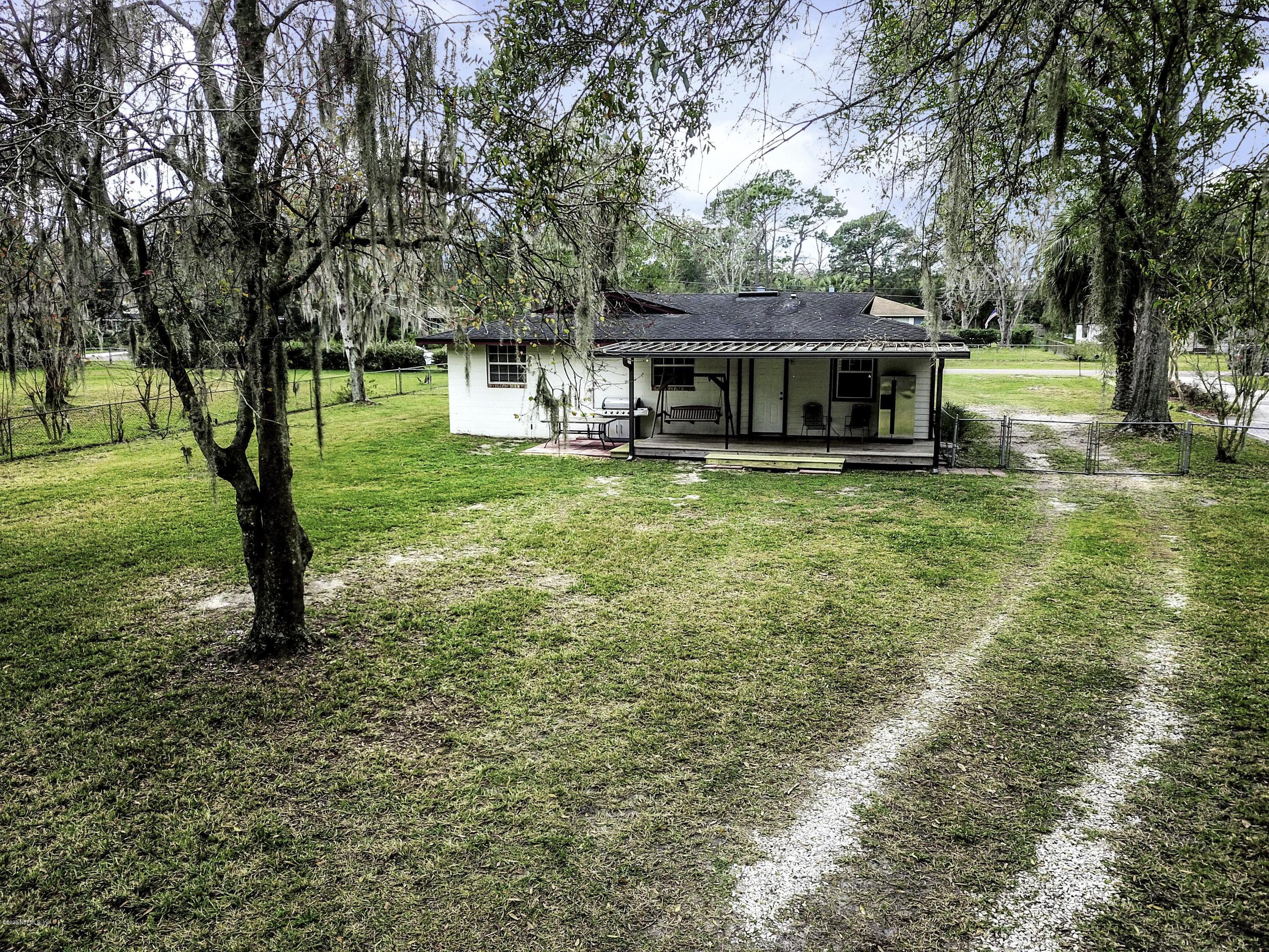 6161 Carlton Road Jacksonville, FL 32244 - Photo 22 of 26 a front view of a house with garden