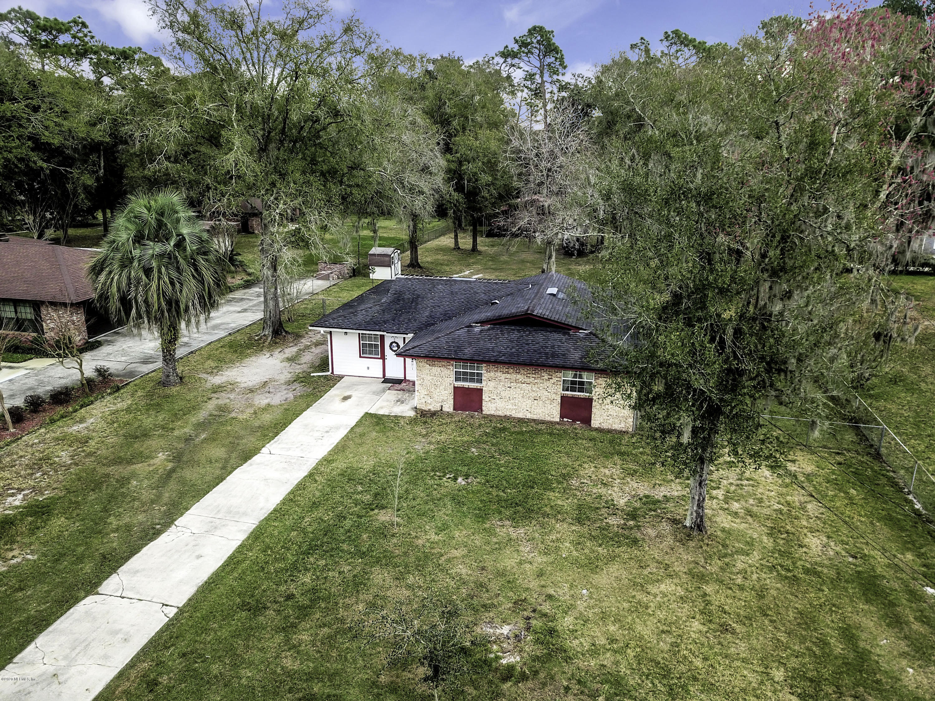 6161 Carlton Road Jacksonville, FL 32244 - Photo 24 of 26 an aerial view of a house with yard