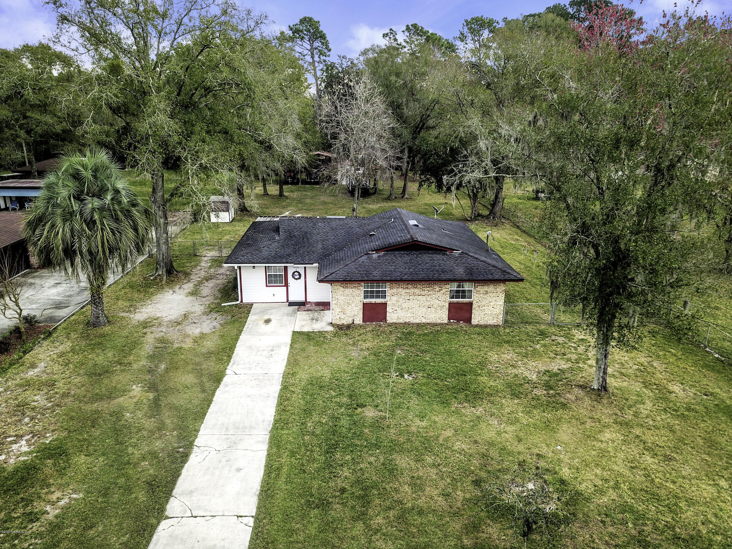 6161 Carlton Road Jacksonville, FL 32244 - Photo 25 of 26 a view of a house with a yard