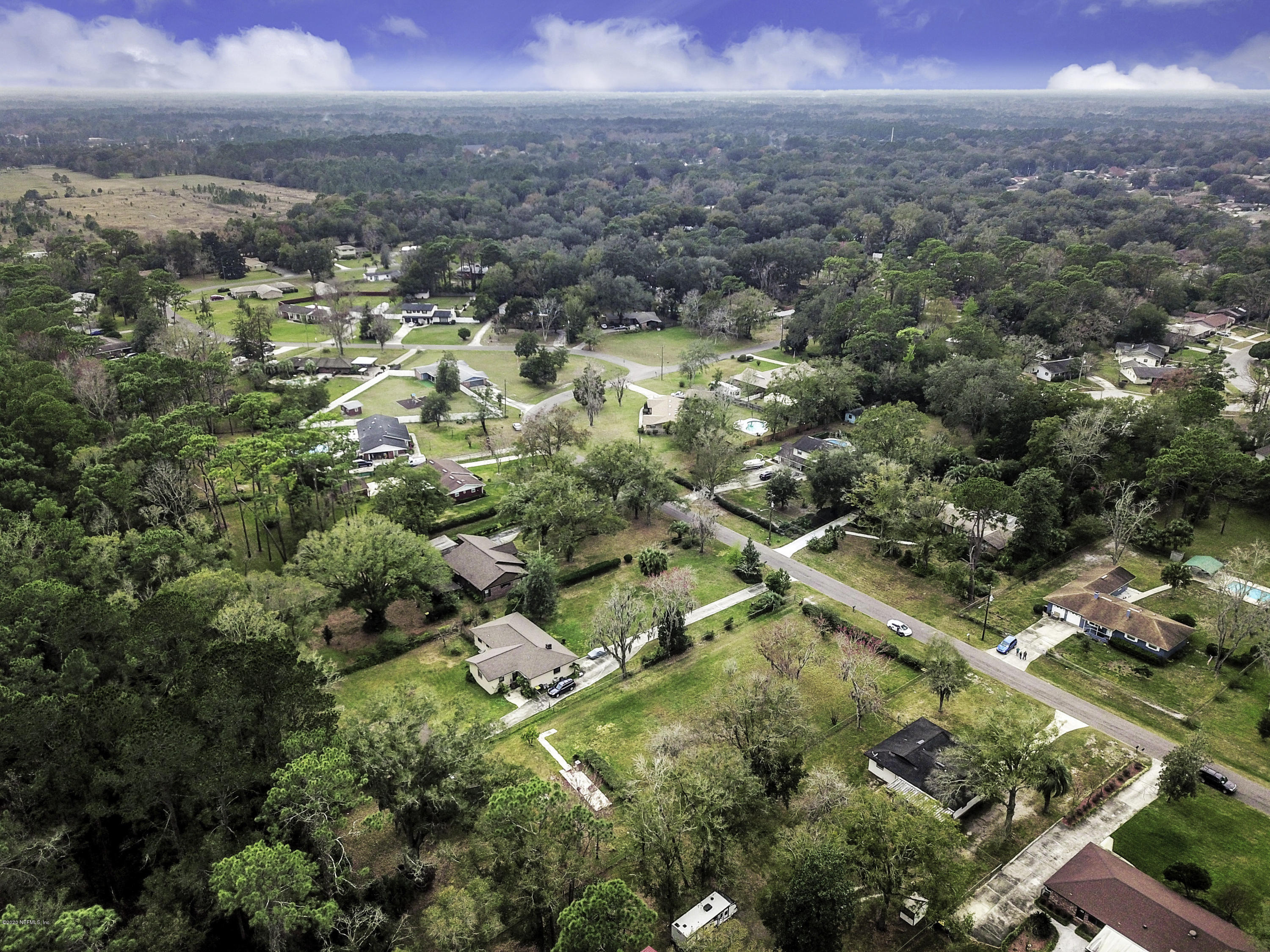 6161 Carlton Road Jacksonville, FL 32244 - Photo 26 of 26 an aerial view of residential houses with outdoor space and trees
