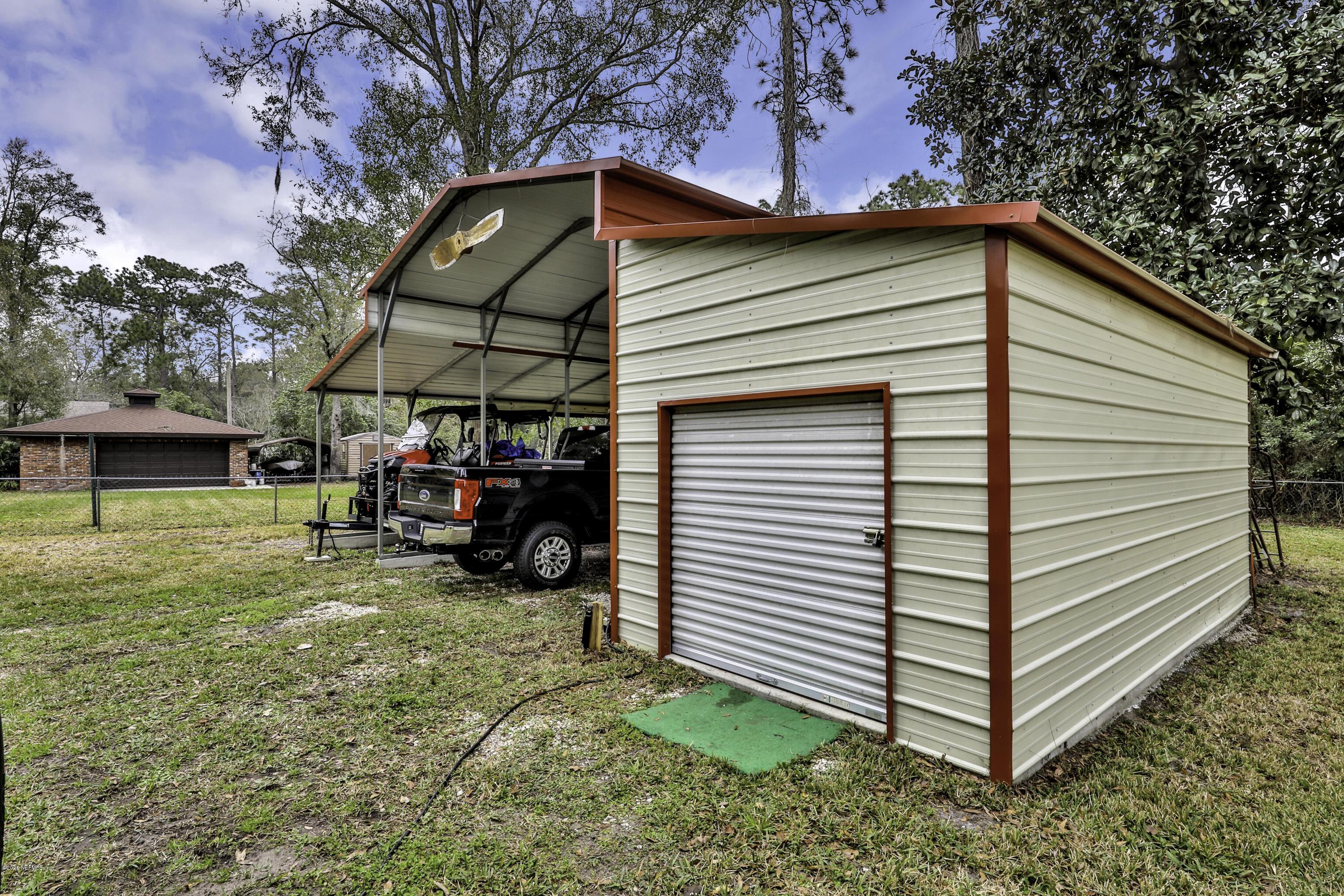 6161 Carlton Road Jacksonville, FL 32244 - Photo 3 of 26 a view of a house with a yard