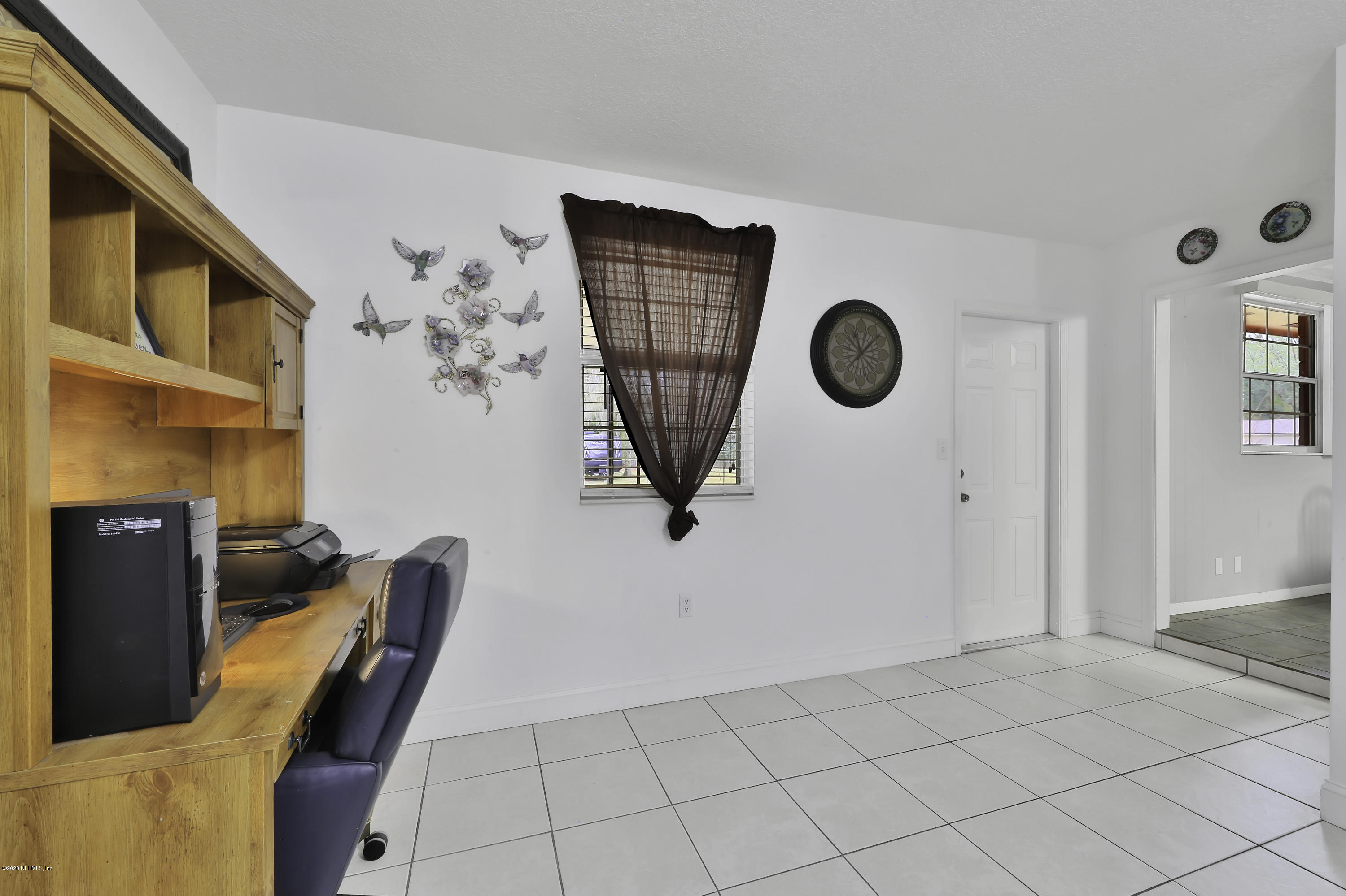 6161 Carlton Road Jacksonville, FL 32244 - Photo 10 of 26 a view of kitchen with furniture and refrigerator