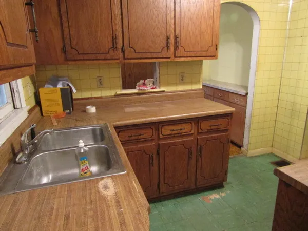 a kitchen with a sink and cabinets