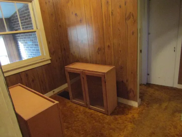 a view of an entryway with a door