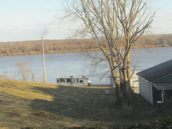 a backyard of a house with lots of water fountain and tree