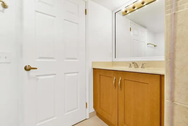 a bathroom with a shower and a sink
